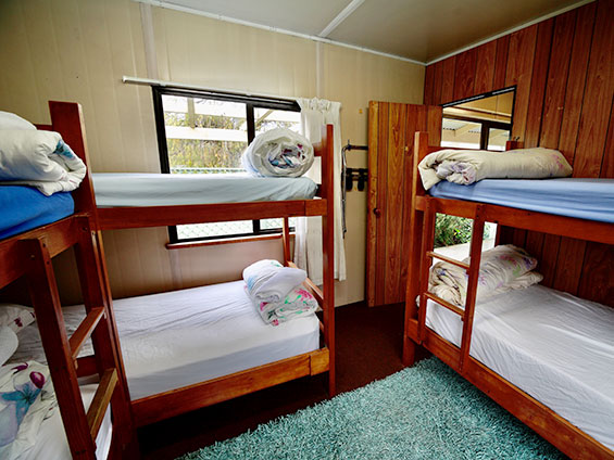six single beds in the room and two sleep on double sofa bed - kitchen cabin
