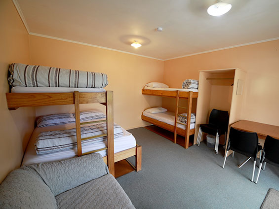 a double bed and 3 single beds in the standard cabin